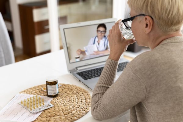 close-up-senior-woman-talking-online-doctor-scaled.jpg