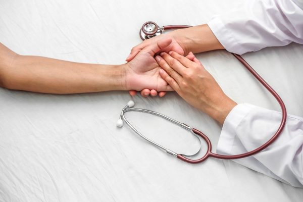 hand-doctor-reassuring-her-female-patient-scaled.jpg